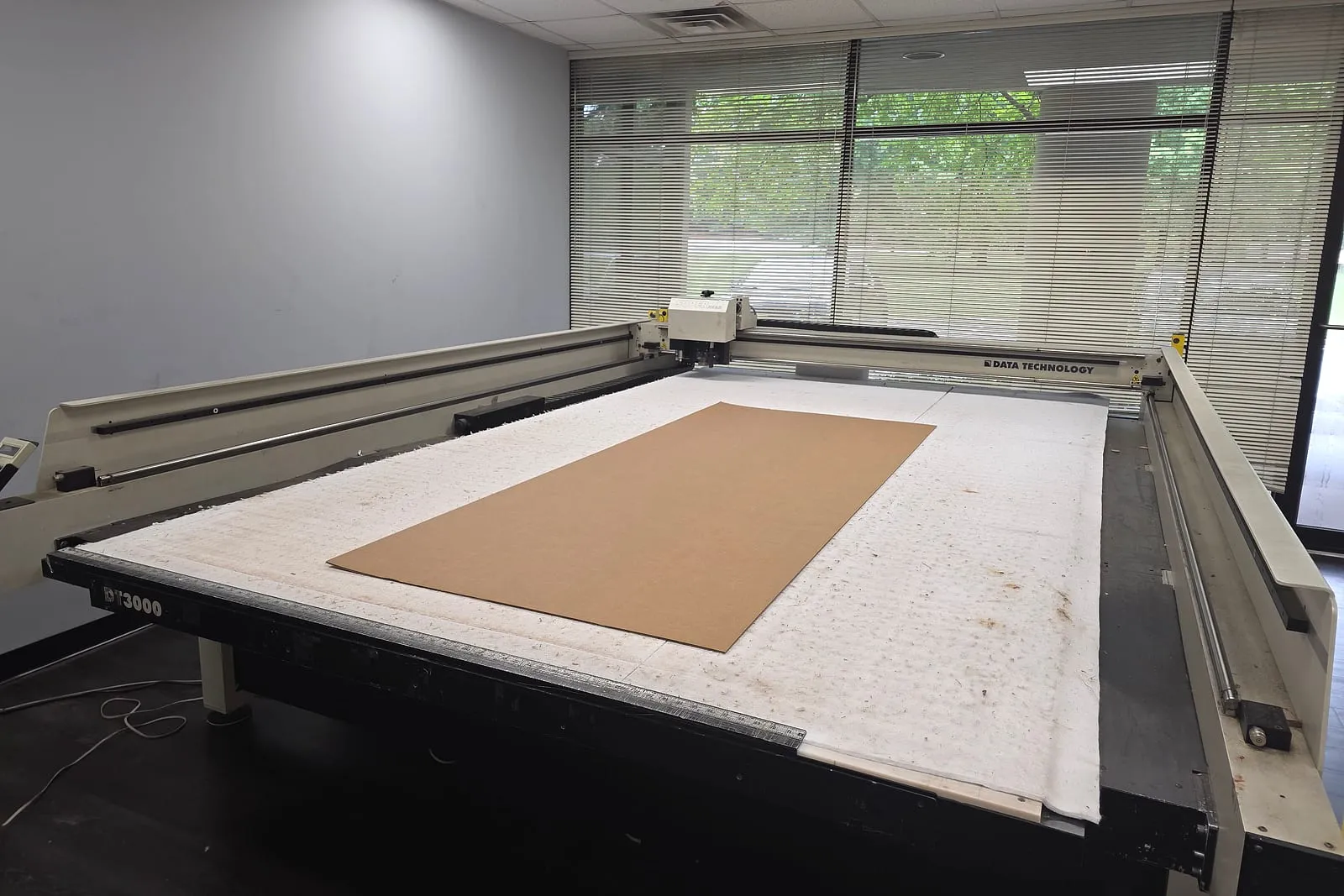 Sample room with digital cutting table at Armor